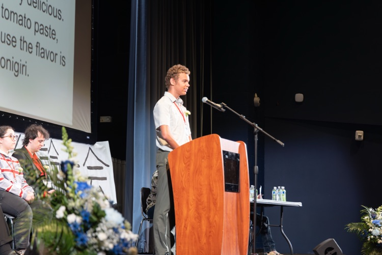 student at a podium reciting a speech