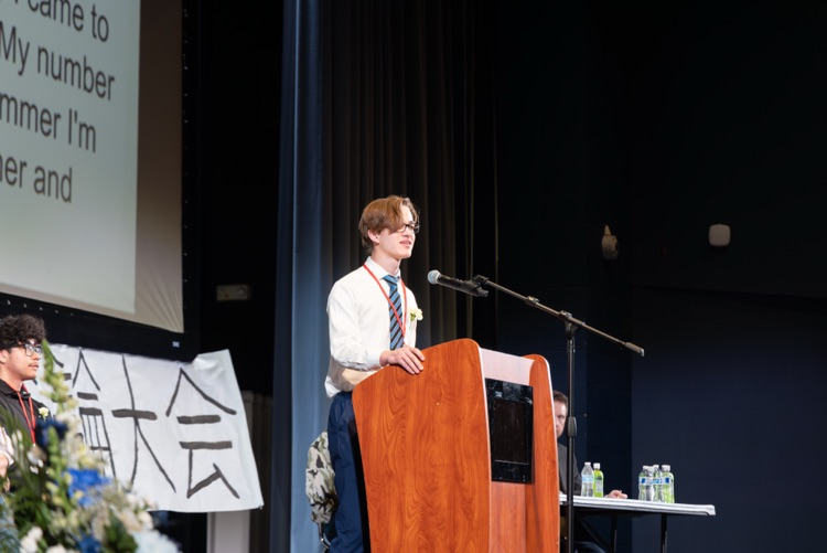 student at a podium reciting a speech
