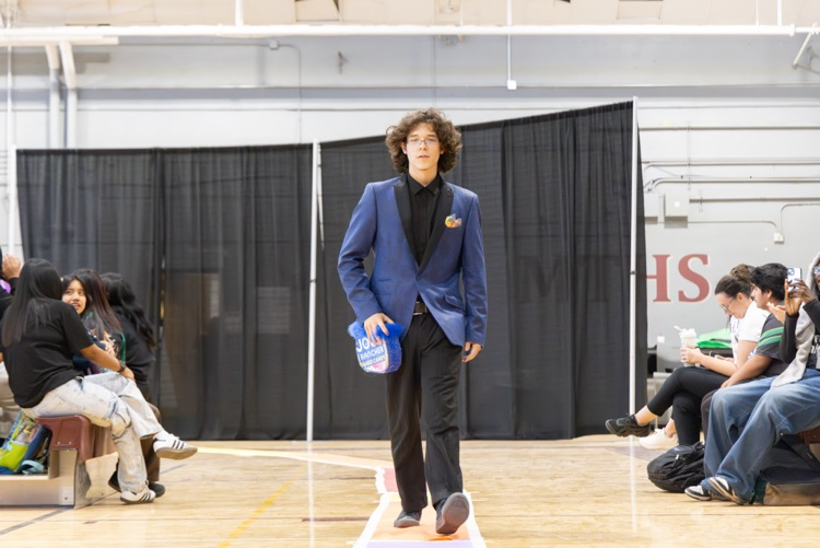 boy in blue blazer with black outfit underneath