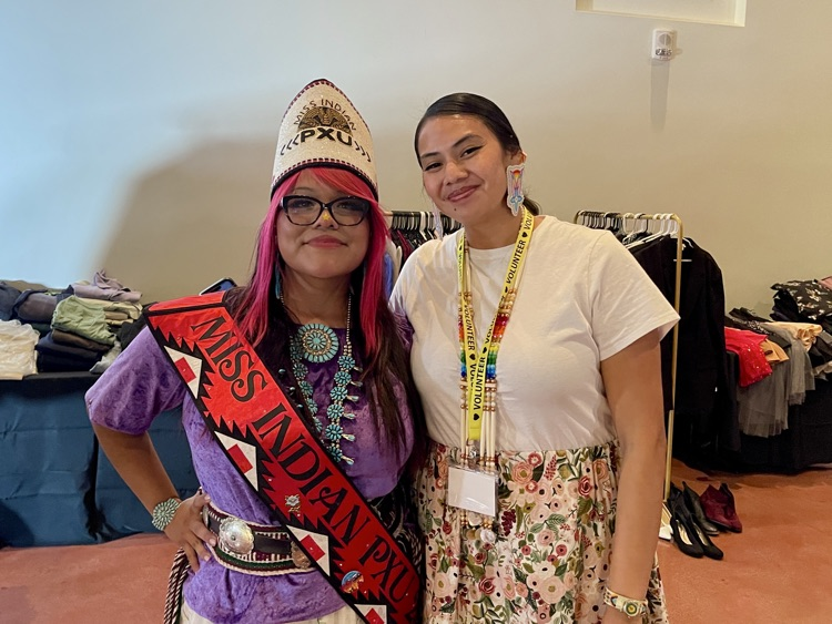 student in Native American garments with PXU staff member