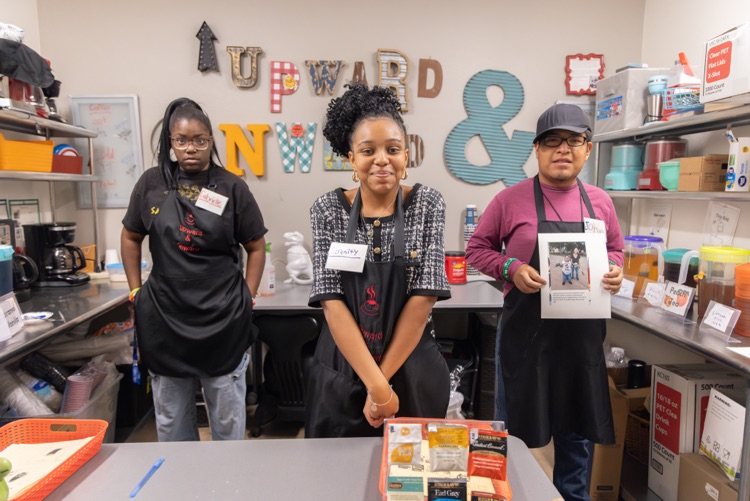 3 students in the upward and onward cafe