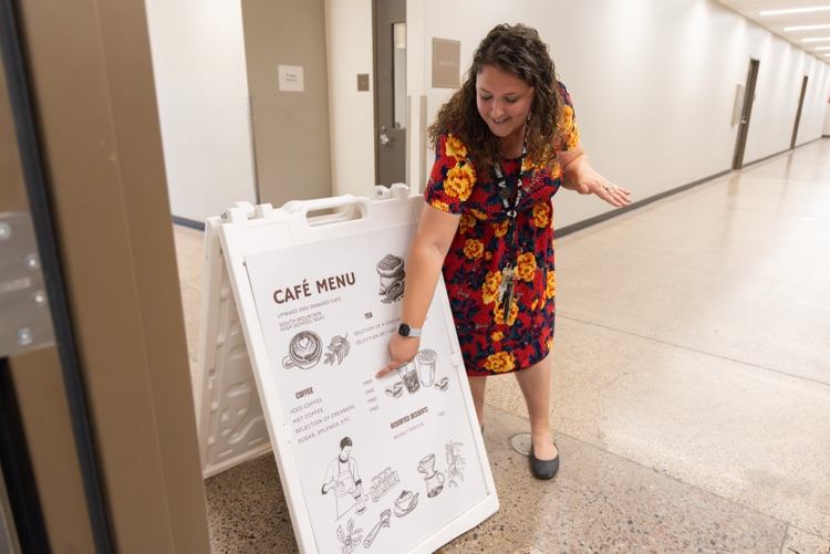 teacher points to sign