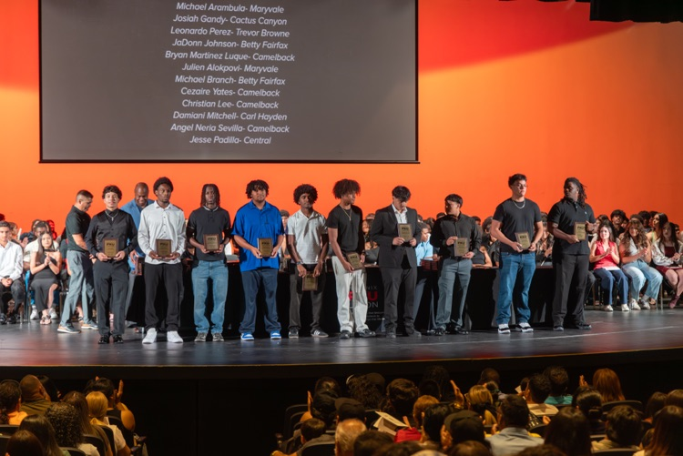 students and coaches on stage at the All PXU sports awards