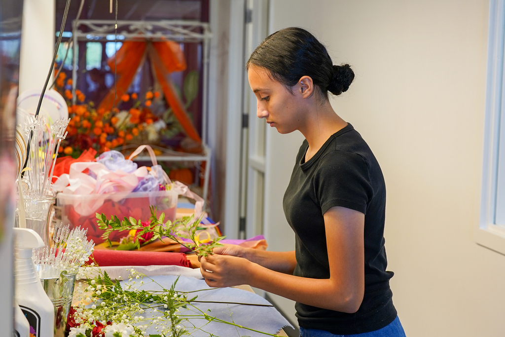 Metro Tech Flower Shop Grand Opening, Student working on floral design