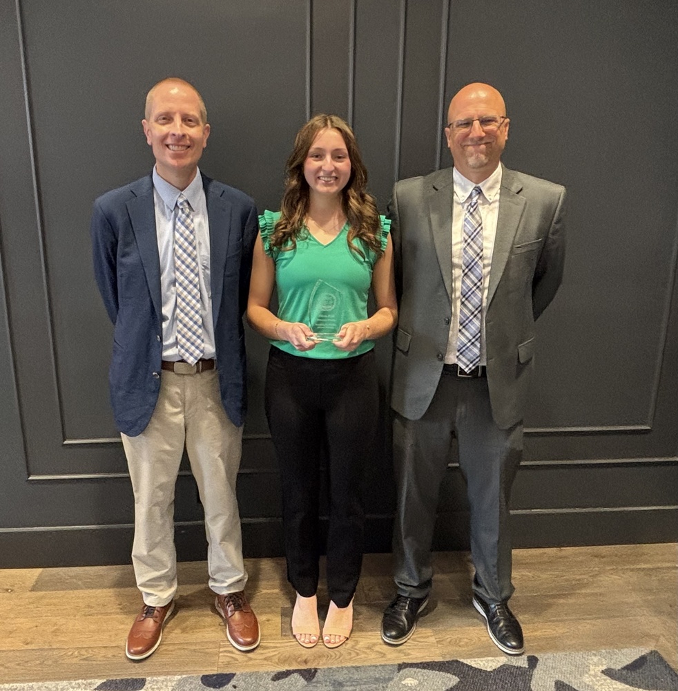 FBW award winner Olivia Dick with principal and superintendent