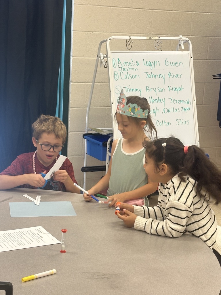 Mrs. Shealey's class working together on writing a paragraph.
