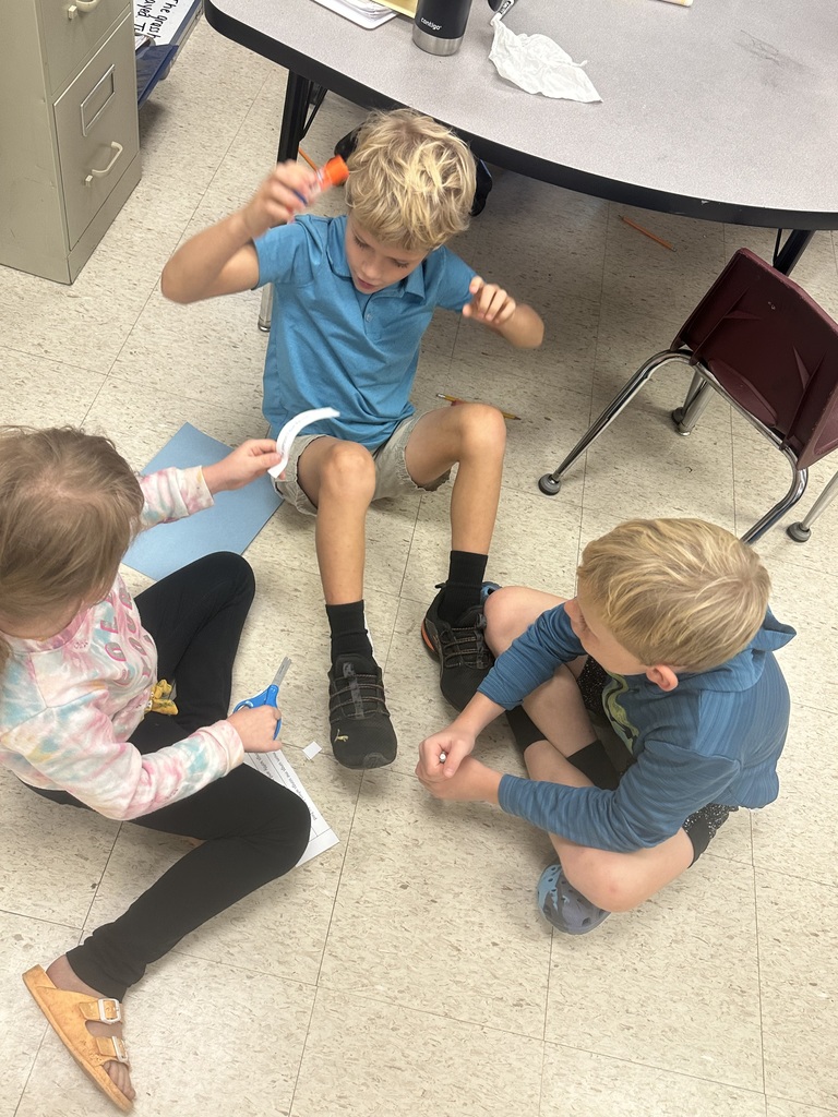 Mrs. Shealey's class working together on writing a paragraph.