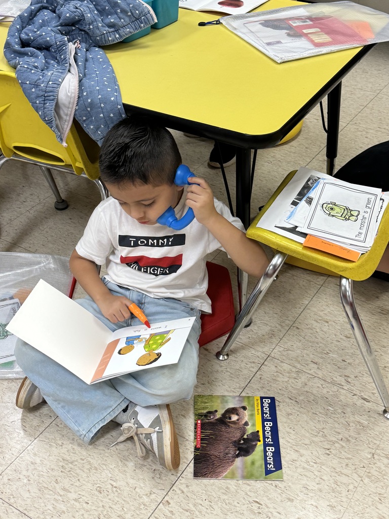 Whisper phone reading in kindergarten.