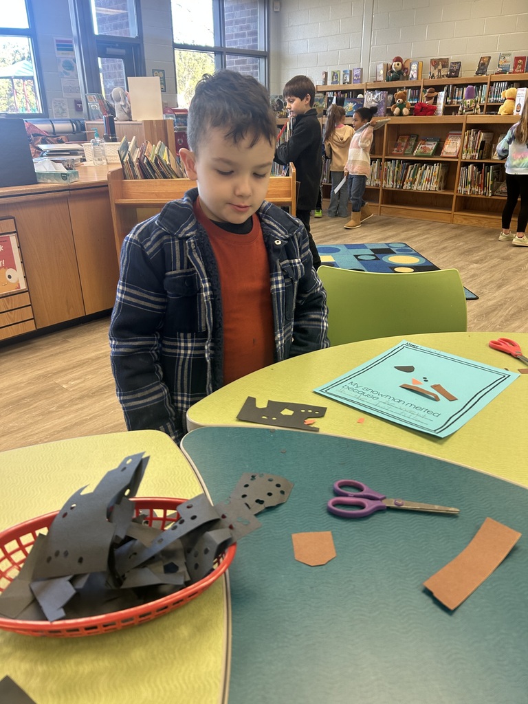 First graders writing about a melted snowman.