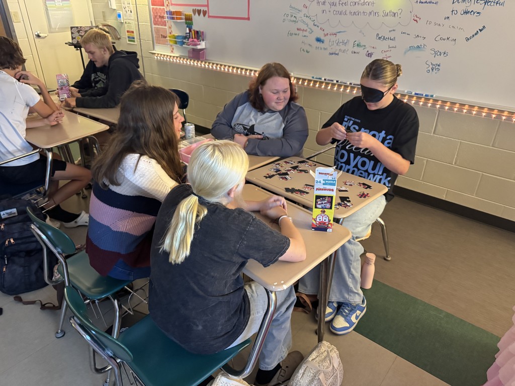 Students working  on the puzzle challenge.