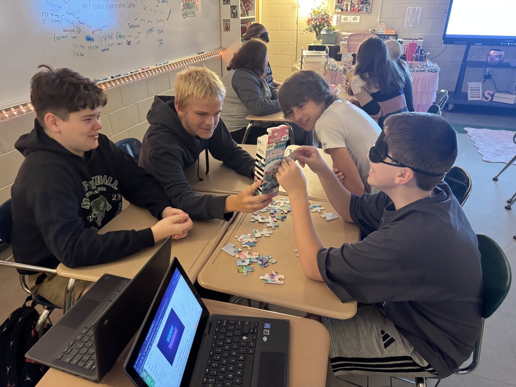 Students working  on the puzzle challenge.