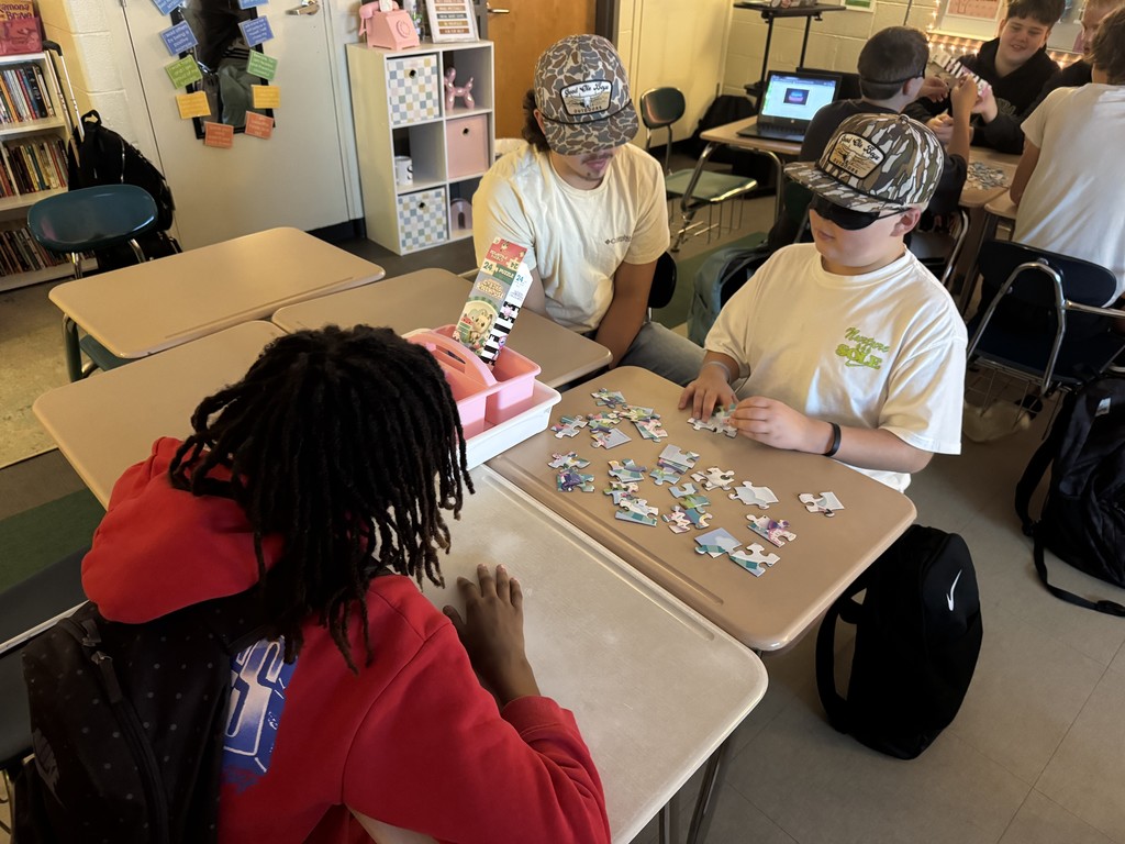 Students working  on the puzzle challenge.