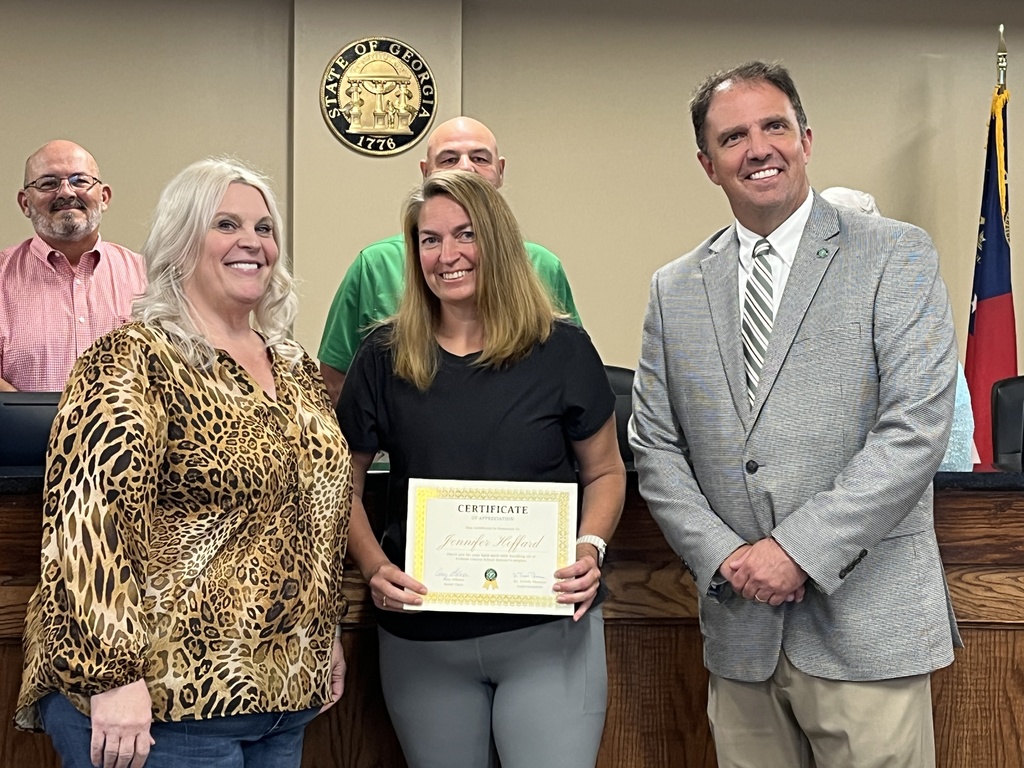 Photo honoring our Warehouse Manager Jennifer Hoffard. L-R Amy Gibson, Jennifer Hoffard, Dr. Travis Thomas