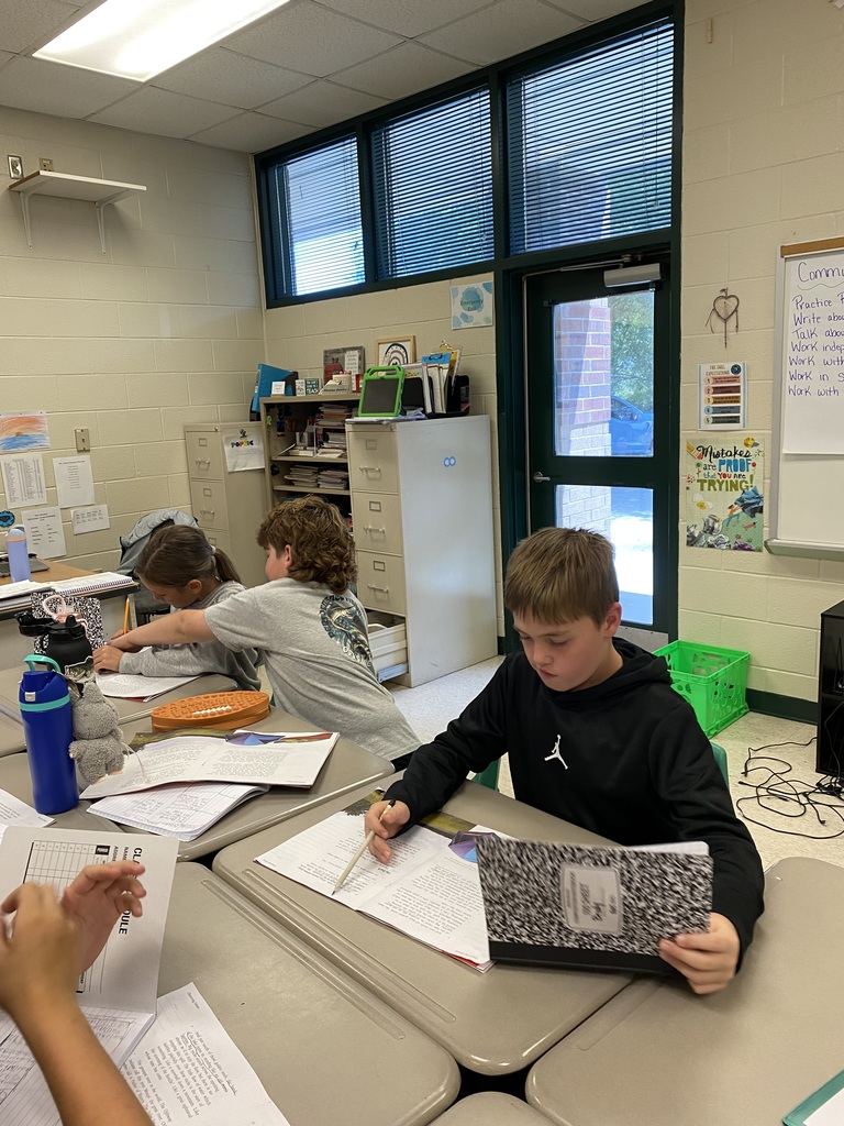 Mrs. Justice's class is working in teams to find relevant details