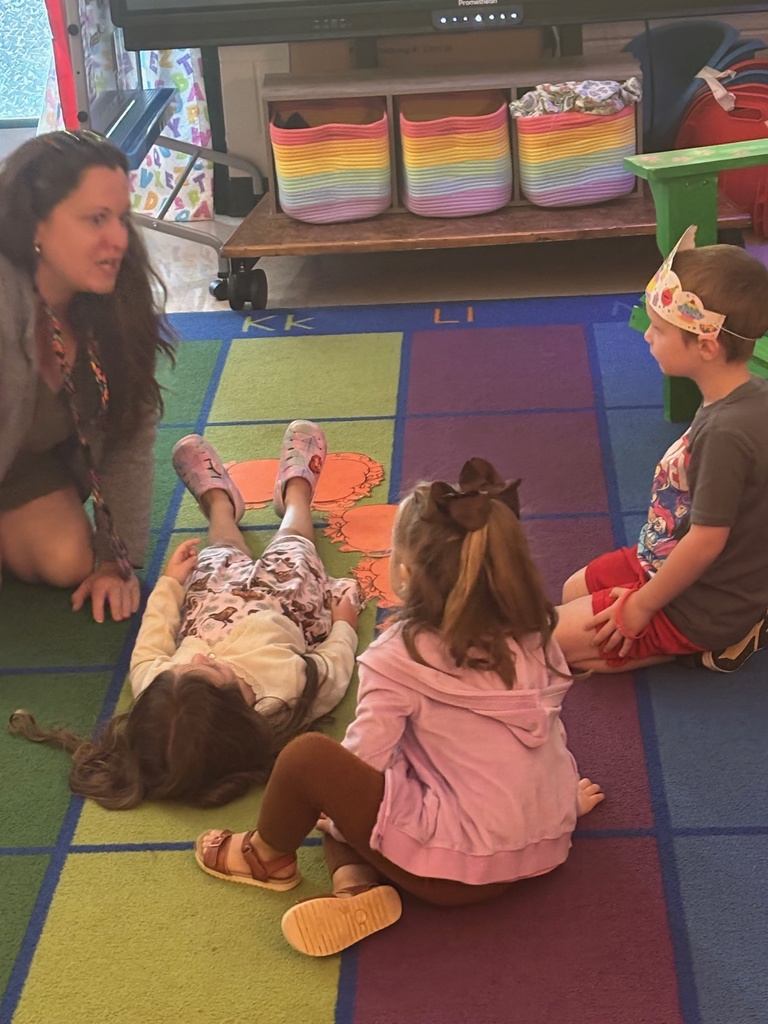 Measuring with pumpkins in Mrs. Anderson's PreK.