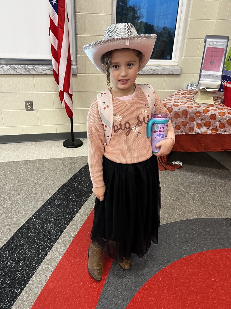 Female student standing in the cafeteria dressed as cowgirl to celebrate red ribbon week