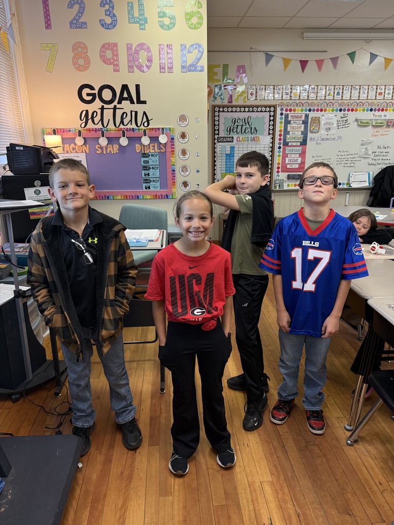 Group of kids standing in front of a classroom dressed in career day clothes for Red Ribbon Week