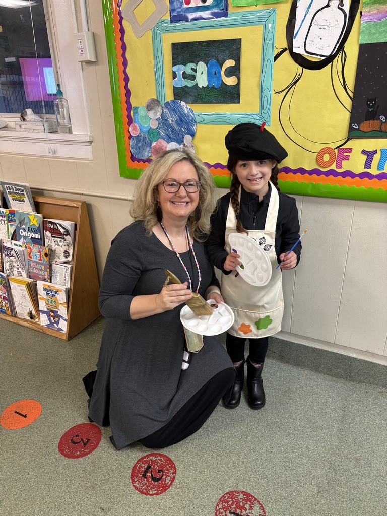 Art Teacher and student standing in front of an art billboard both dressed as art teachers on career day  for Red Ribbon Week