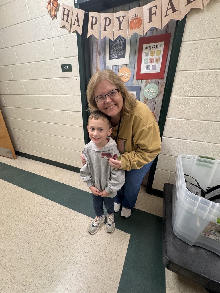PreK students sharing bookmarks they made.