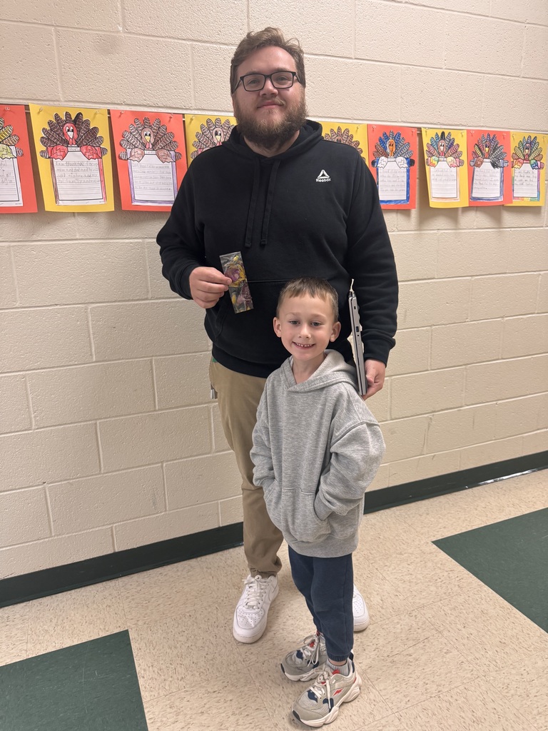 PreK students sharing bookmarks they made.