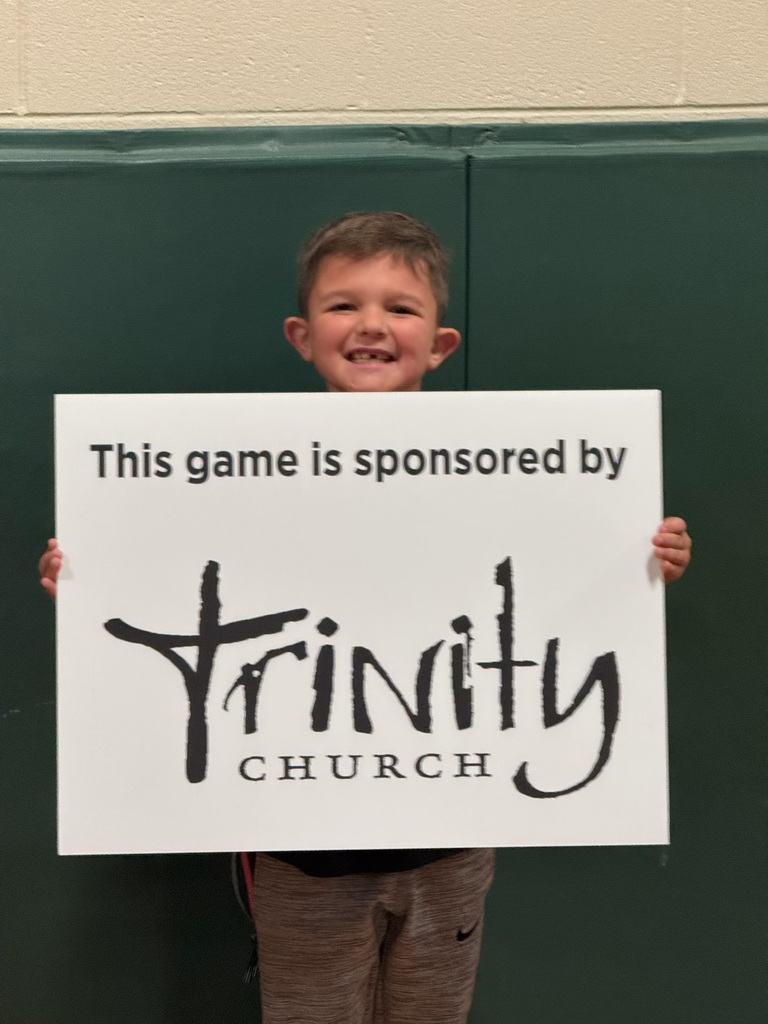 Child holding a sponsorship sign 