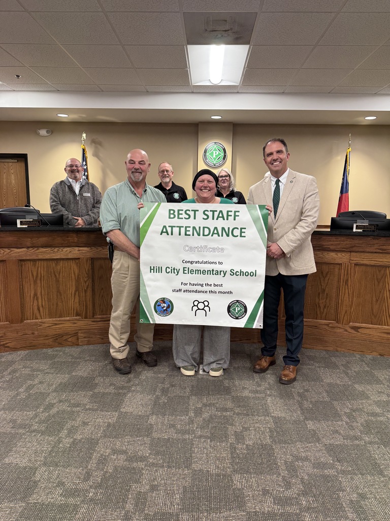 Hill City Elementary principals accepting the Best Staff Attendance award.