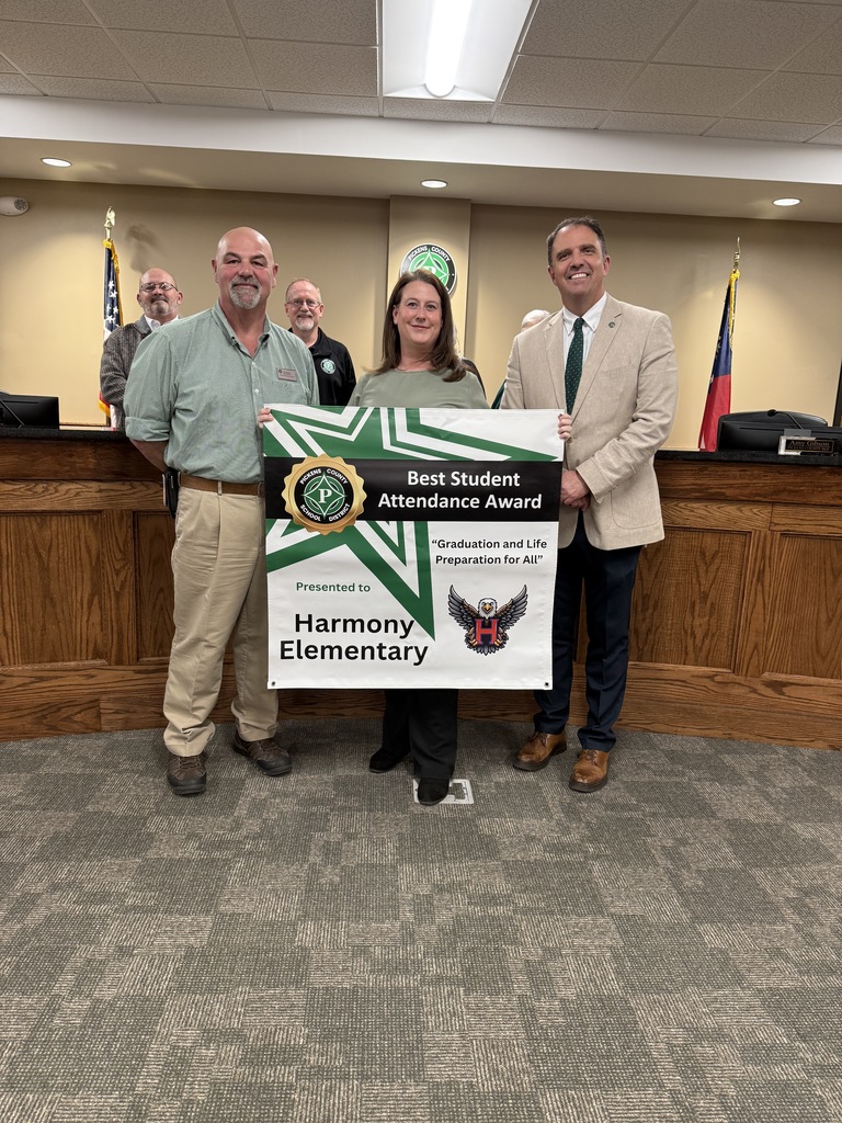 Harmony Assistant Principal accepting the award for best student attendance. 