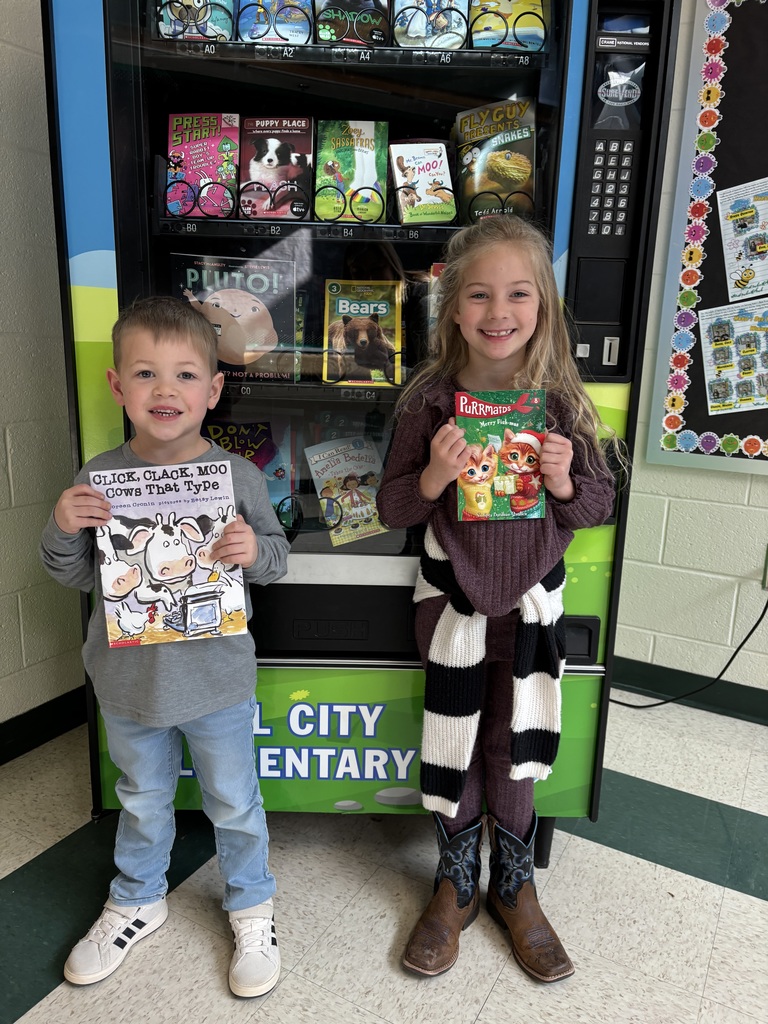 Landon and Ella earn a trip to the Book Vending Machine for their sight words.