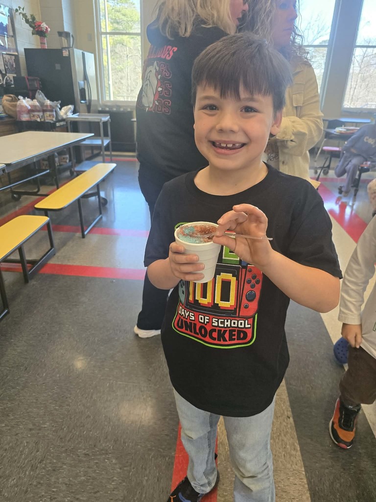 Male student smiling with a snowcone