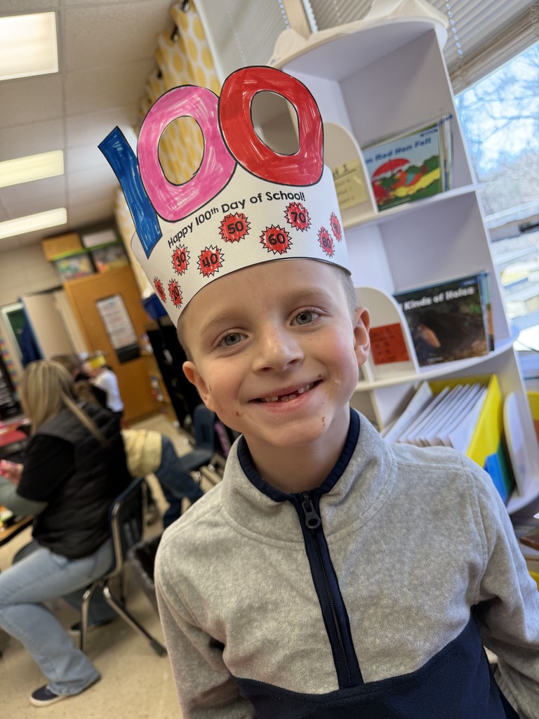 Boy with hat with the number 100 on it