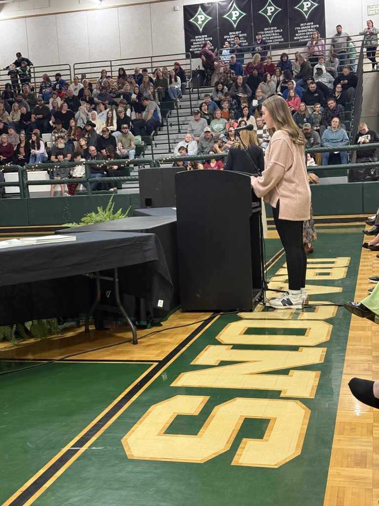 Side shot of a girl standing at the podium
