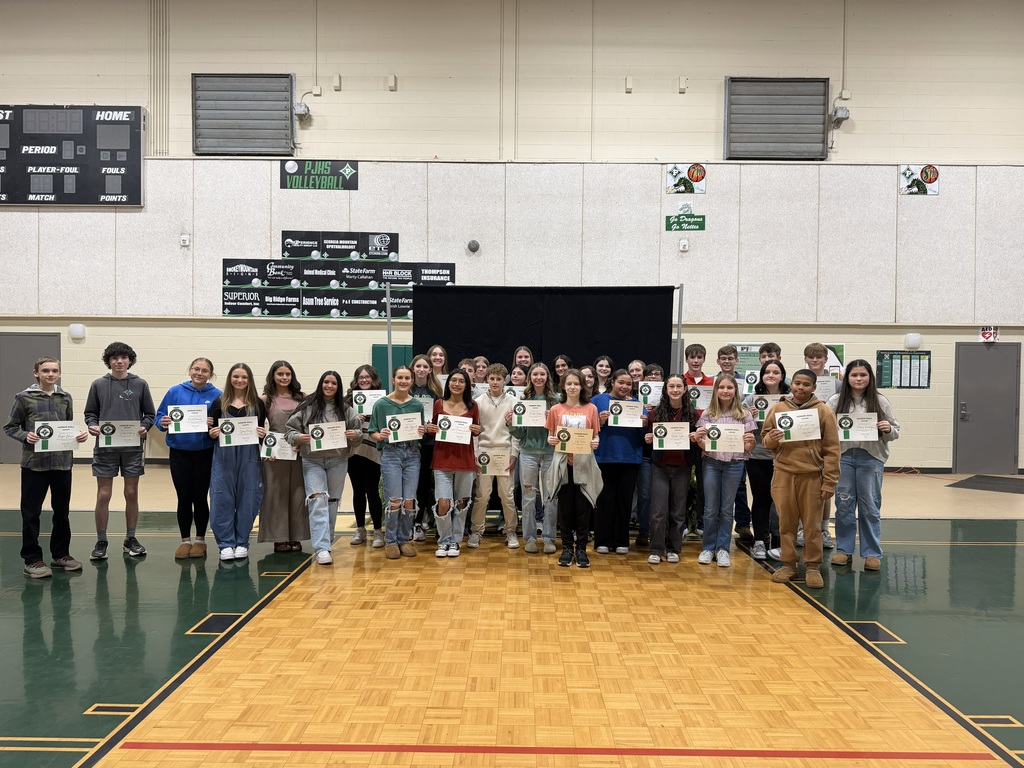 8th Grade Honor Roll students with their certificates