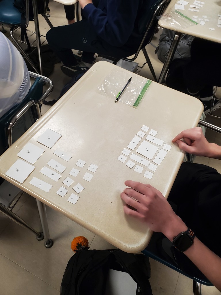 Student working with algebra tiles