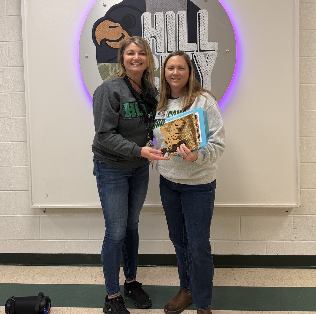 Ms. Jamie receives the Hawk Award from Mrs. Gilleland.