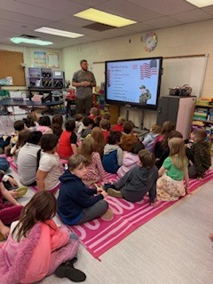 Classroom of students watching a presenter