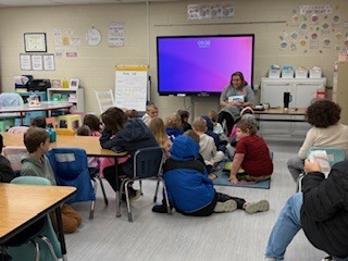 Classroom of students watching a presenter