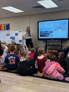 Classroom of students watching a presenter