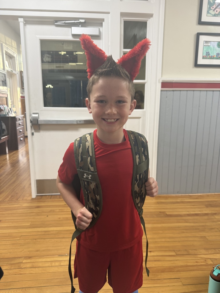 boy in red shirt and red fox ears