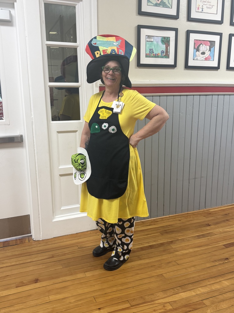 Woman dressed up as a chef with green eggs and ham