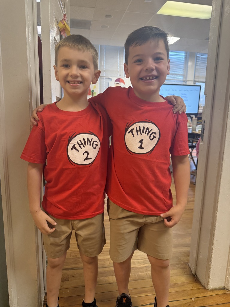 two boys in red thing 1 and thing 2 shirts