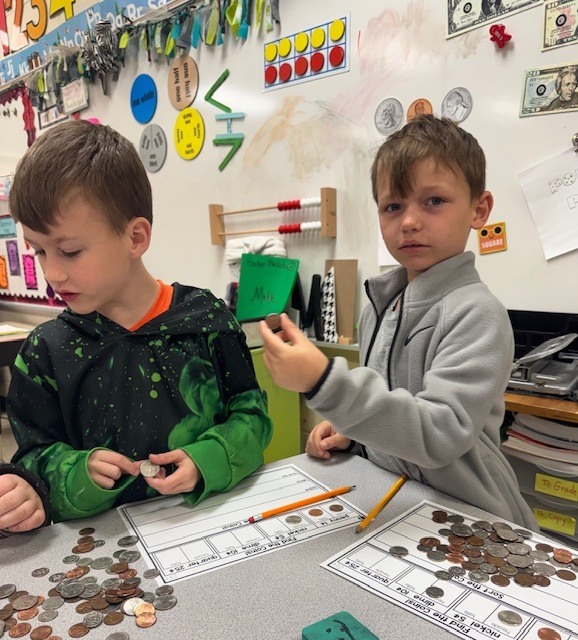 Counting and sorting money in Ms. Sultan's first grade math classes.