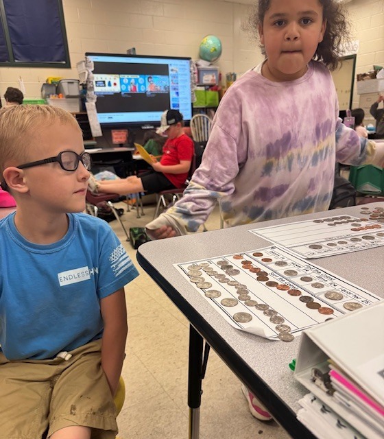 Counting and sorting money in Ms. Sultan's first grade math classes.