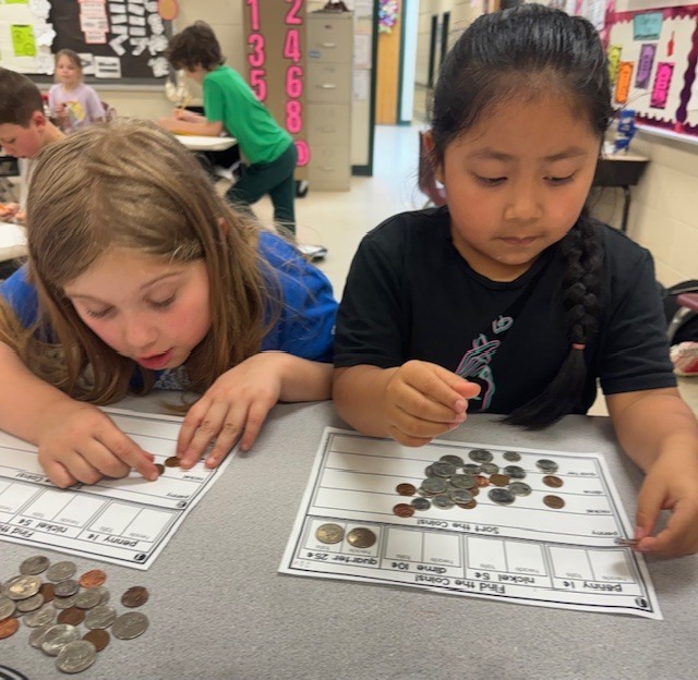 Counting and sorting money in Ms. Sultan's first grade math classes.