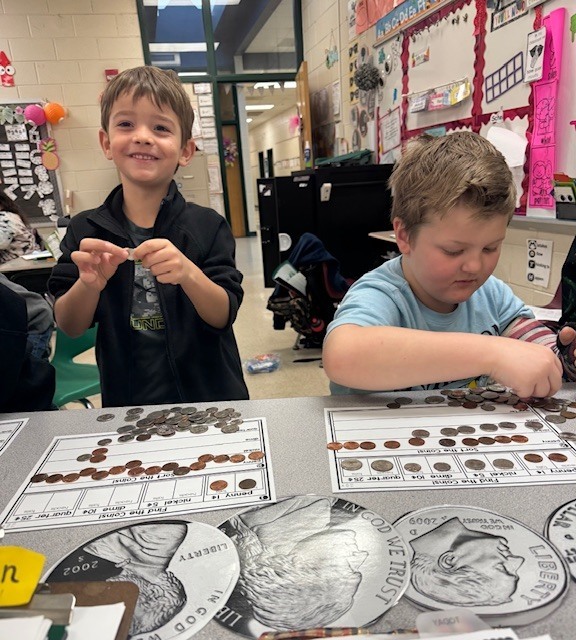 Counting and sorting money in Ms. Sultan's first grade math classes.
