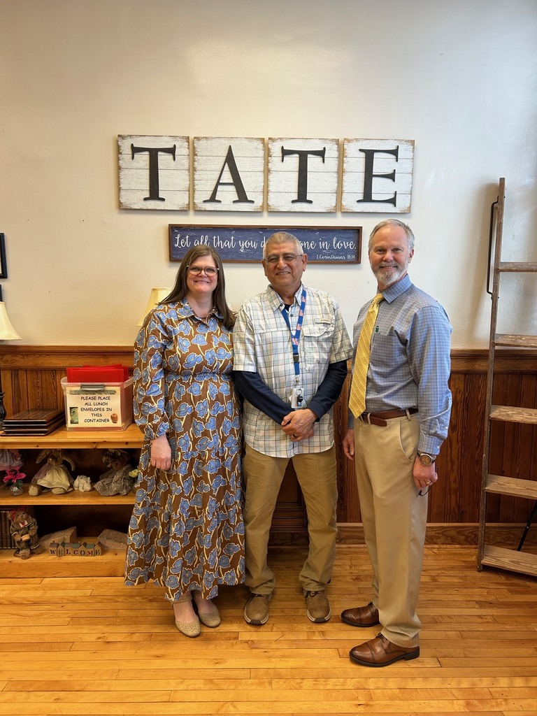 one woman and two men standing together