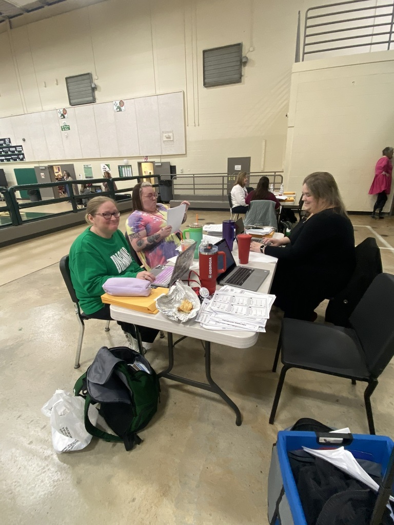 Teachers Cassie Sanders, Cherish Bentley and Rachel Waters seated at a table