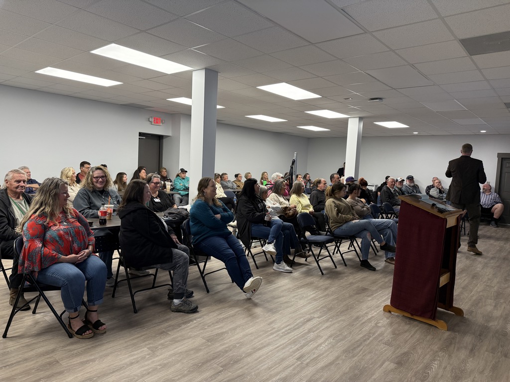 Group of PCSD Bus Drivers listening to speaker