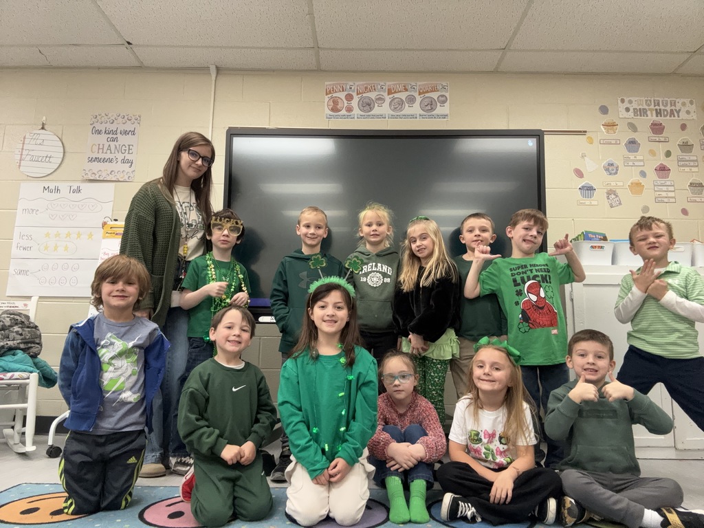group of students some students all wearing green