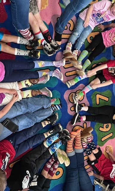 We All Rocked Our Socks!   Today we celebrated World Down Syndrome Day by wearing fun, colorful socks to promote inclusion and acceptance.  Our kindergartners (representing all classes) and their teachers proudly showed off their unique styles—and they rocked them! #RockYourSocks #InclusionMatters
