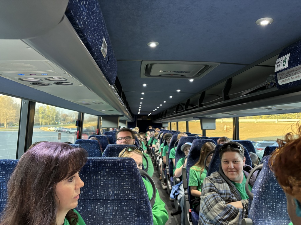 Chaperones and students on the bus and ready to depart